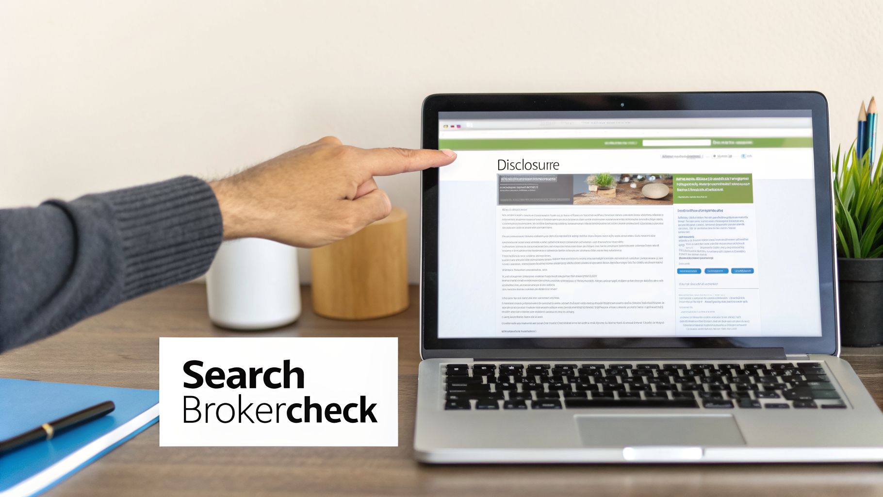 A person's hand points at a laptop displaying a webpage with the title 'Disclosurre'.