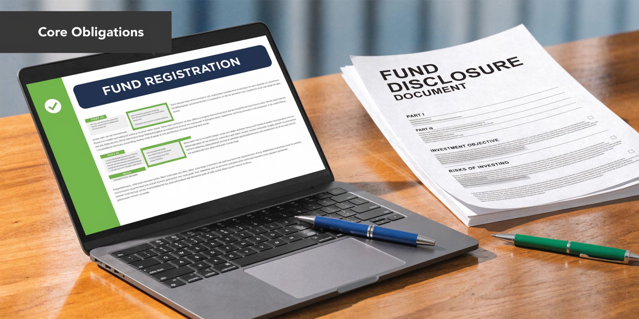 A laptop showing a fund registration document next to a printed fund disclosure document on a wooden desk.