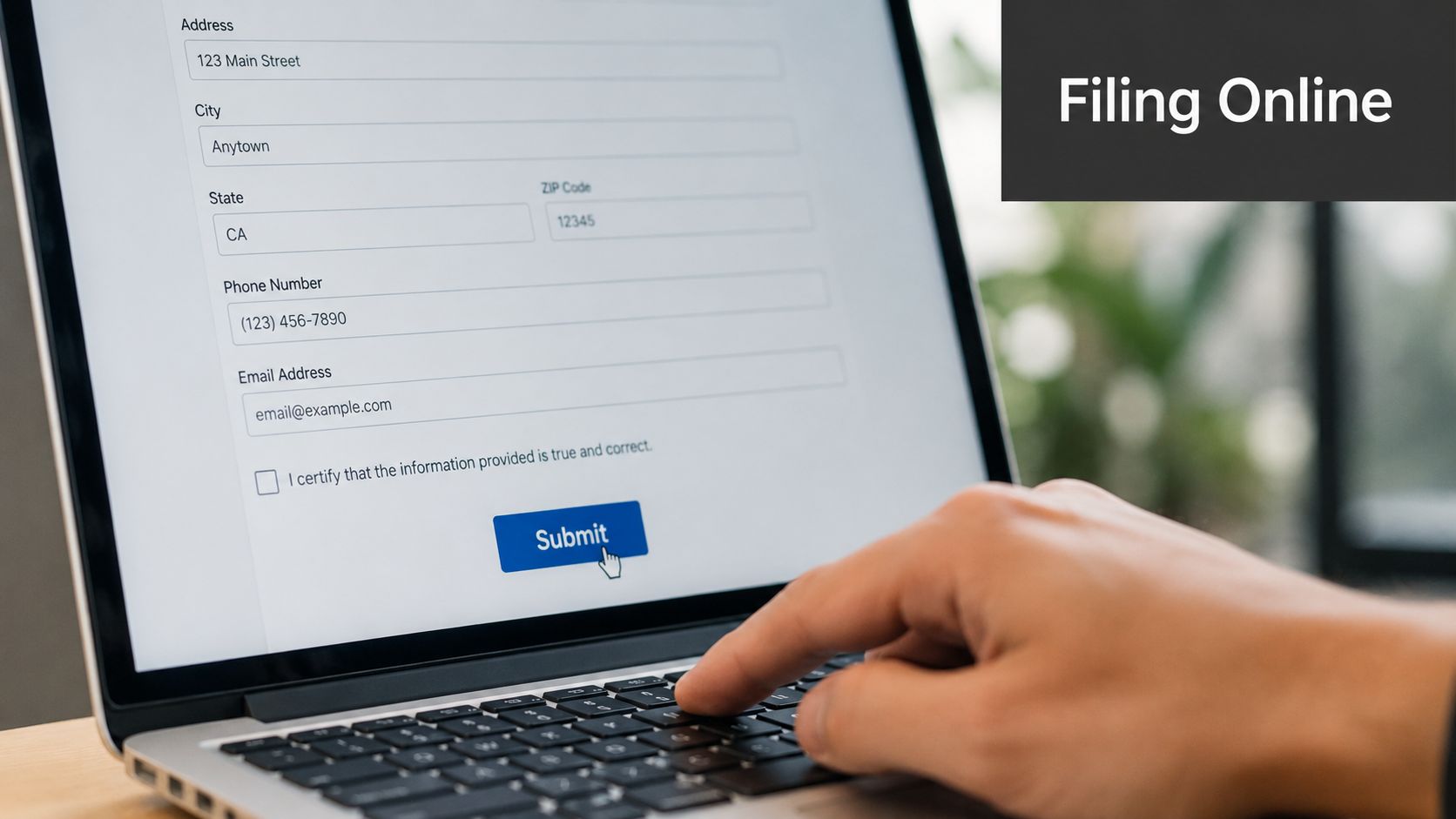 A person filling out an online form on a laptop to file a complaint.